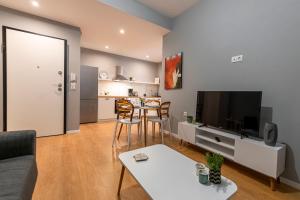 A television and/or entertainment centre at Athenian center apartments