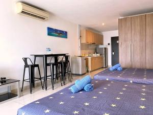 a kitchen with two blue pillows on the floor at KSL D'Esplanade Apartment Suites by SC Homestay in Johor Bahru
