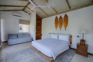 Rúm í herbergi á O2 Villas Yala