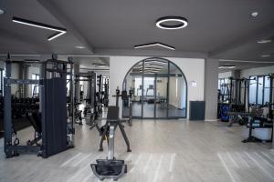 a gym with several treadmills and machines in a room at Midyat Royal Hotel & Spa in Midyat