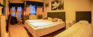 Postel nebo postele na pokoji v ubytování Euroway Hotel