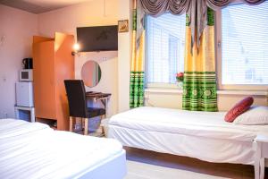 Postel nebo postele na pokoji v ubytování Euroway Hotel