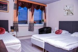 Postel nebo postele na pokoji v ubytování Euroway Hotel