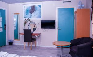 TV a/nebo společenská místnost v ubytování Euroway Hotel