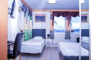 Postel nebo postele na pokoji v ubytování Euroway Hotel