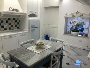 a kitchen with a table with a bowl on it at Casa Buditto in Orvieto