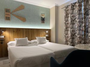 Postel nebo postele na pokoji v ubytování Alameda Hostal Boutique