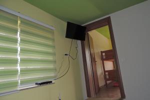 A television and/or entertainment centre at Hostel Villa Popović