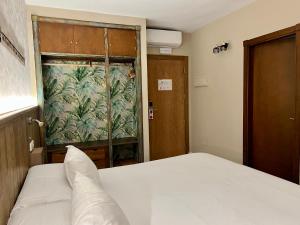 Postel nebo postele na pokoji v ubytování Alameda Hostal Boutique