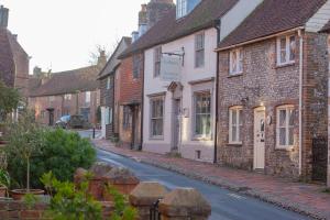 a street in a small town with houses at Bell Cottage in Alfriston