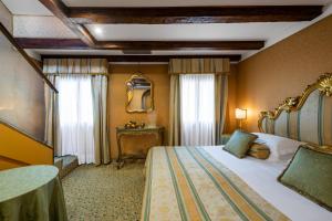 Postel nebo postele na pokoji v ubytování Hotel Concordia