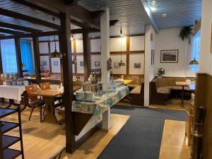 a dining room with a table with plates on it at Hotel Zum Klüverbaum in Bremen