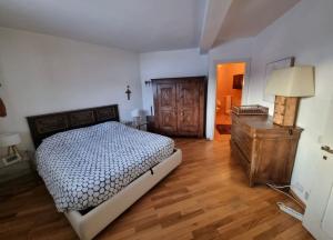 Postel nebo postele na pokoji v ubytování Fiocco di Neve Apartment + 8 fotografií