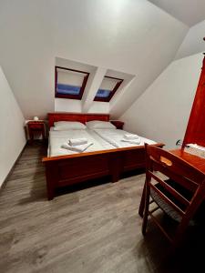 Postel nebo postele na pokoji v ubytování Hotel Modrava