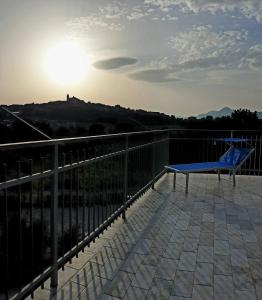 a blue bench sitting on top of a balcony at DiVino in Spinoso