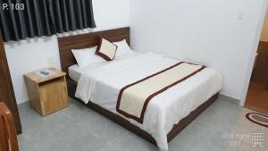 Postel nebo postele na pokoji v ubytování Vy An Hotel