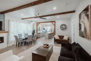a living room with a couch and a table at Urban Rustic Getaway in Corvallis