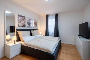 Postel nebo postele na pokoji v ubytování Modernisiertes Altbau 3-Zi Apartment