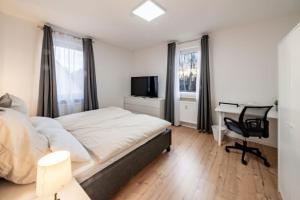 Postel nebo postele na pokoji v ubytování Modernisiertes Altbau 3-Zi Apartment + 4 fotografie