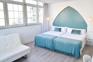 Кровать или кровати в номере Hotel Alda Puerta Del Sol