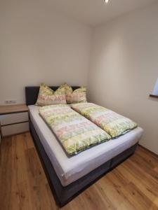 מיטה או מיטות בחדר ב-Apart Schlatter
