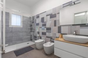 Koupelna v ubytování MolteVolte Rooms + 24 fotografií