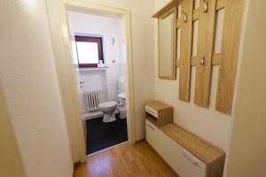 a bathroom with a toilet and a sink at Hotel Zum Klüverbaum in Bremen +32 photos