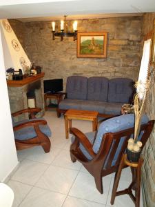 a living room with a couch and a fireplace at Casa Piquero in Sieste