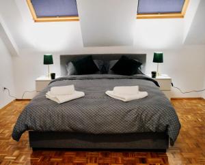 Giường trong phòng chung tại Vlasic Apartmani CENTAR