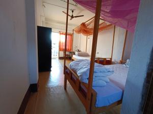 Postel nebo postele na pokoji v ubytování Manipur House