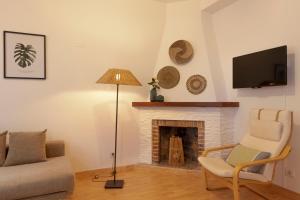 TV a/nebo společenská místnost v ubytování Apartamento Ponent 6