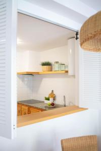 Kuchyň nebo kuchyňský kout v ubytování Apartamento Ponent 6