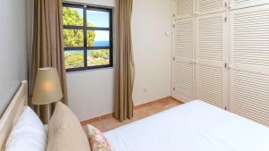 Llit o llits en una habitació de Alfagar Village