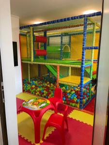 a play room with a table and a play set at Perun Hotel Sandanski in Sandanski