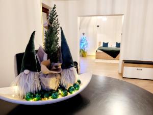 a plate with a christmas decoration on a table at HAFCIK Apartamenty in Poronin