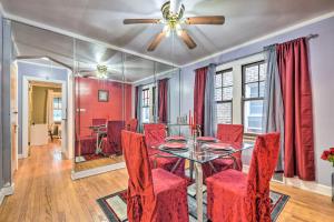 een eetkamer met een tafel en rode stoelen bij Chicago Home with Spacious Yard 14 Mi to Dtwn in Chicago