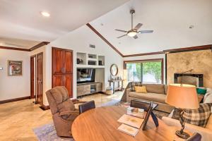 a living room with a table and a couch at Central Scottsdale Home with Pool Access! in Scottsdale