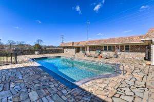 a swimming pool in the backyard of a house at Villa with Pool and Acreage about 10 Mi to Franklin 