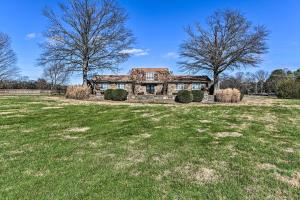 an old stone house with trees in a field at Villa with Pool and Acreage about 10 Mi to Franklin 