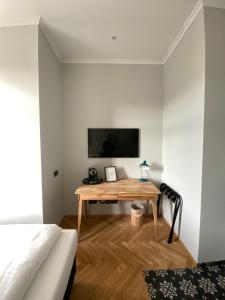 TV a/nebo společenská místnost v ubytování Boutique Hotel Kolbeck