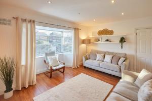 a living room with a couch and a window at Host & Stay - Newsam Crescent in Eaglescliffe