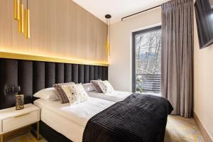 Posteľ alebo postele v izbe v ubytovaní Tatry Residence SPA