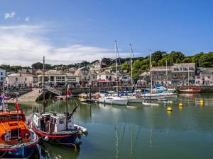 a group of boats are docked in a harbor at Holiday Home Cross Keys by Interhome in Padstow