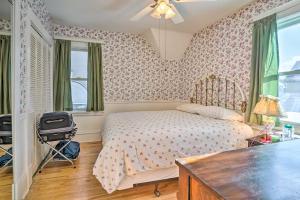 a bedroom with a bed and a desk and a window at Charming Saint Paul Home with Yard, Near Downtown! in Saint Paul