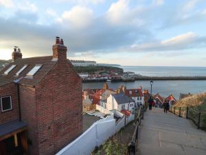 a view of a town next to a body of water at Mariner's Watch in Whitby