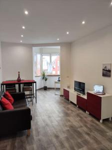 a living room with a couch and a table at [WHITE & WOOD house in Rome] in Rome