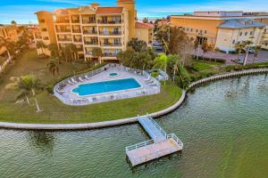 an aerial view of a swimming pool in the water at Palms of Treasure Island 405 in St. Pete Beach