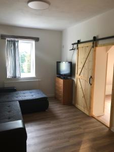 Postel nebo postele na pokoji v ubytování Apartmány Razová - Slezská Harta