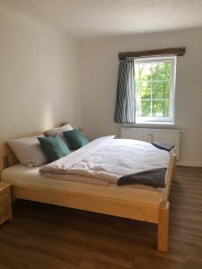 Postel nebo postele na pokoji v ubytování Apartmány Razová - Slezská Harta
