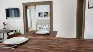 Televízia a/alebo spoločenská miestnosť v ubytovaní Relax Apartments Sárvár A1